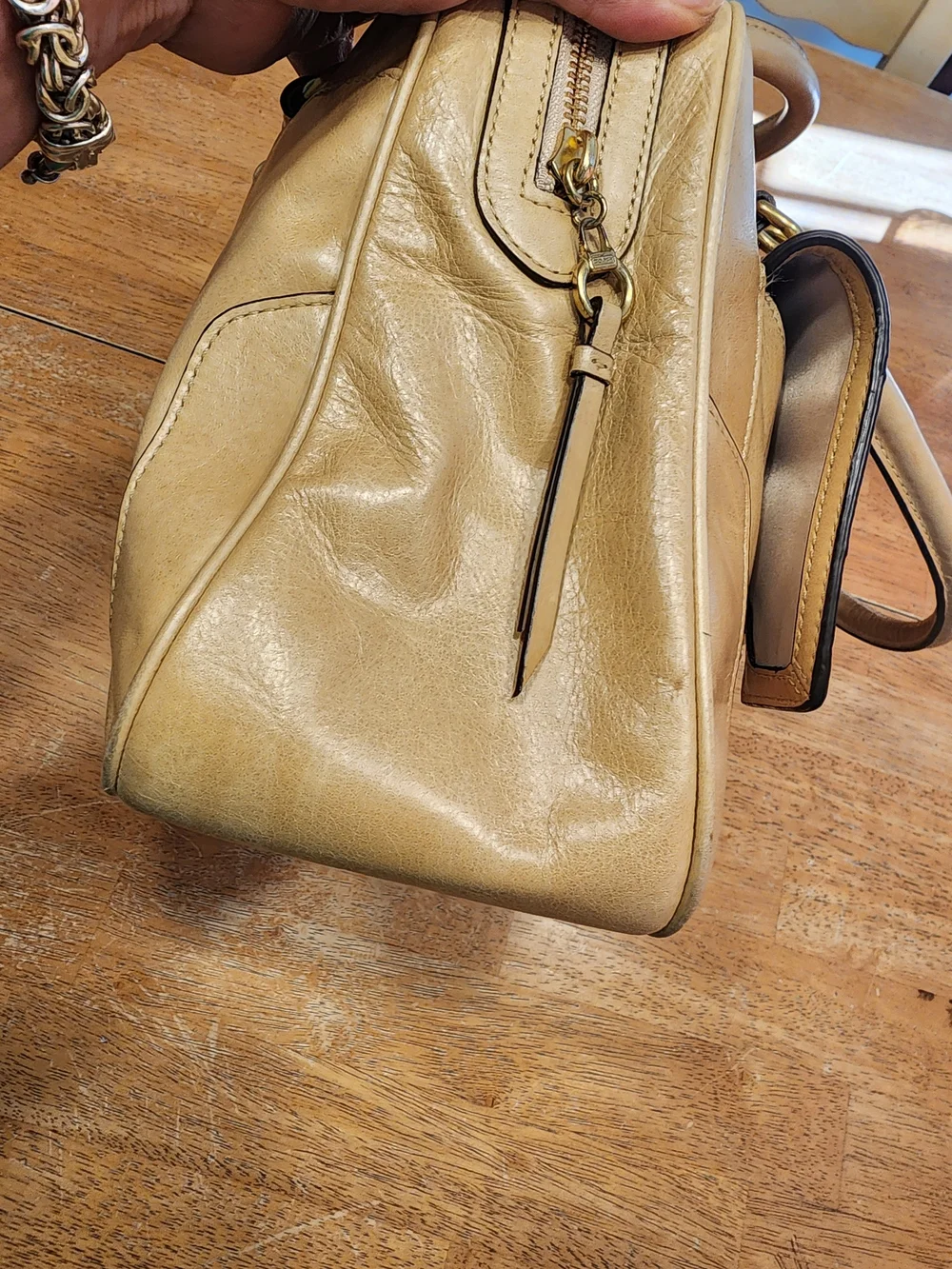 2011 Coach Poppy Push Lock Satchel features a beige leather exterior